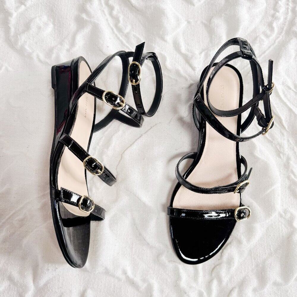 Stuart Weitzman Grecian Buckle Wedge Sandal In Black Patent Leather